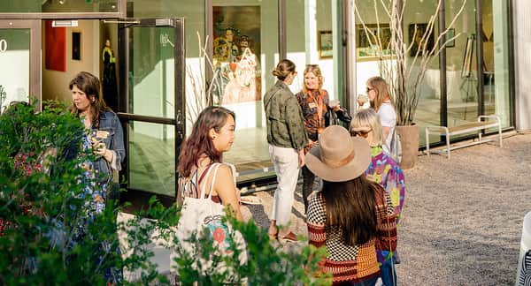 Women standing talking to eachother